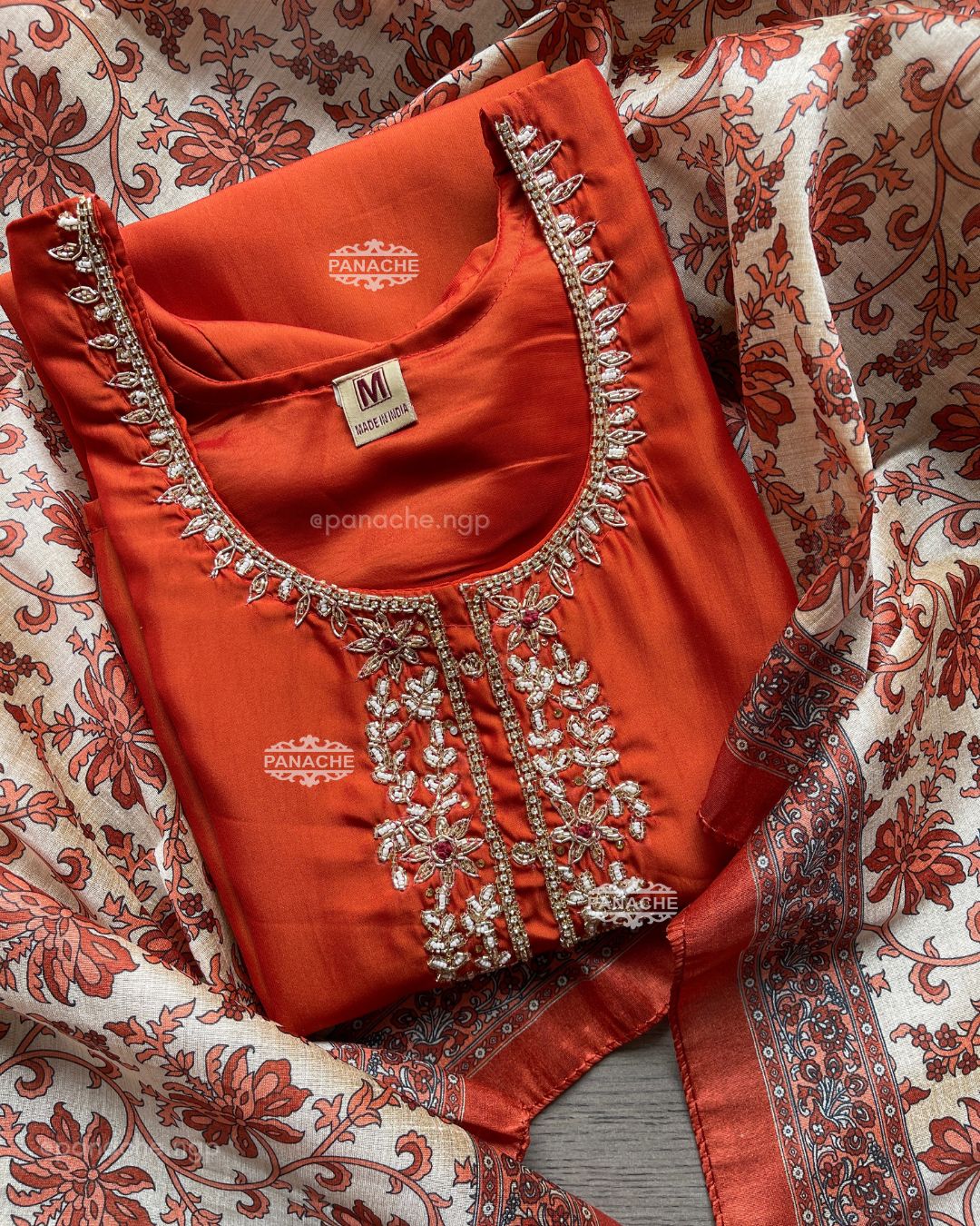 Shades of rust & orange suit